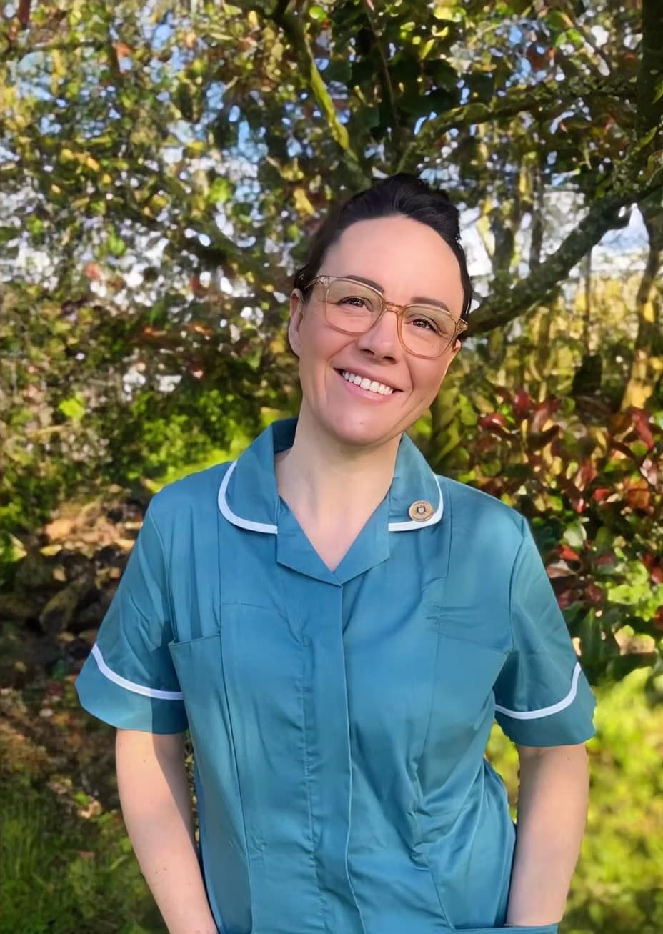 Ashleigh Warman, Foot Health Practitioner at Devon Foot Health, in her blue tunic